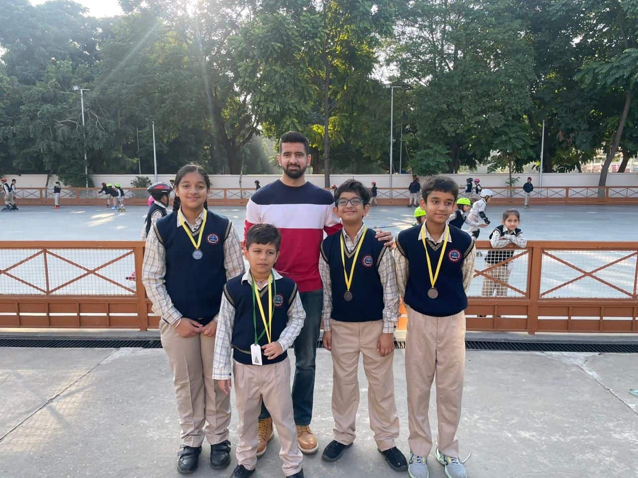 Parth with four of his students wearing their medals