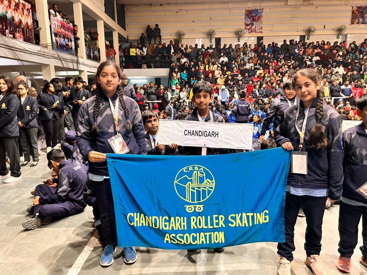 Young Chandigarh skaters with the CRSA banner at the nationals