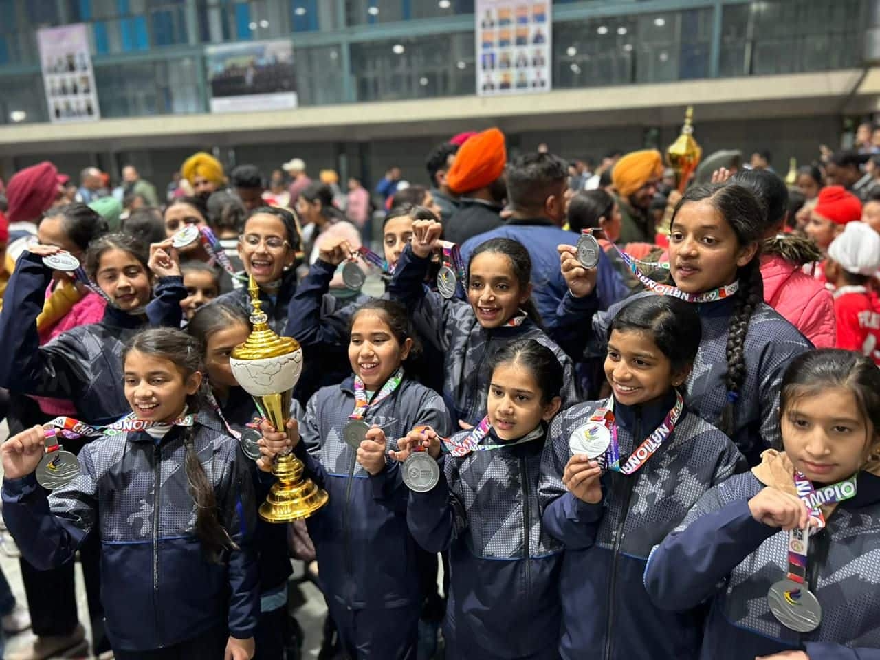 Students with medals and a trophy at the nationals
